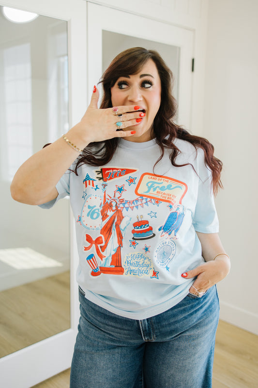 Woman wearing a patriotic graphic t-shirt in front of a mirror