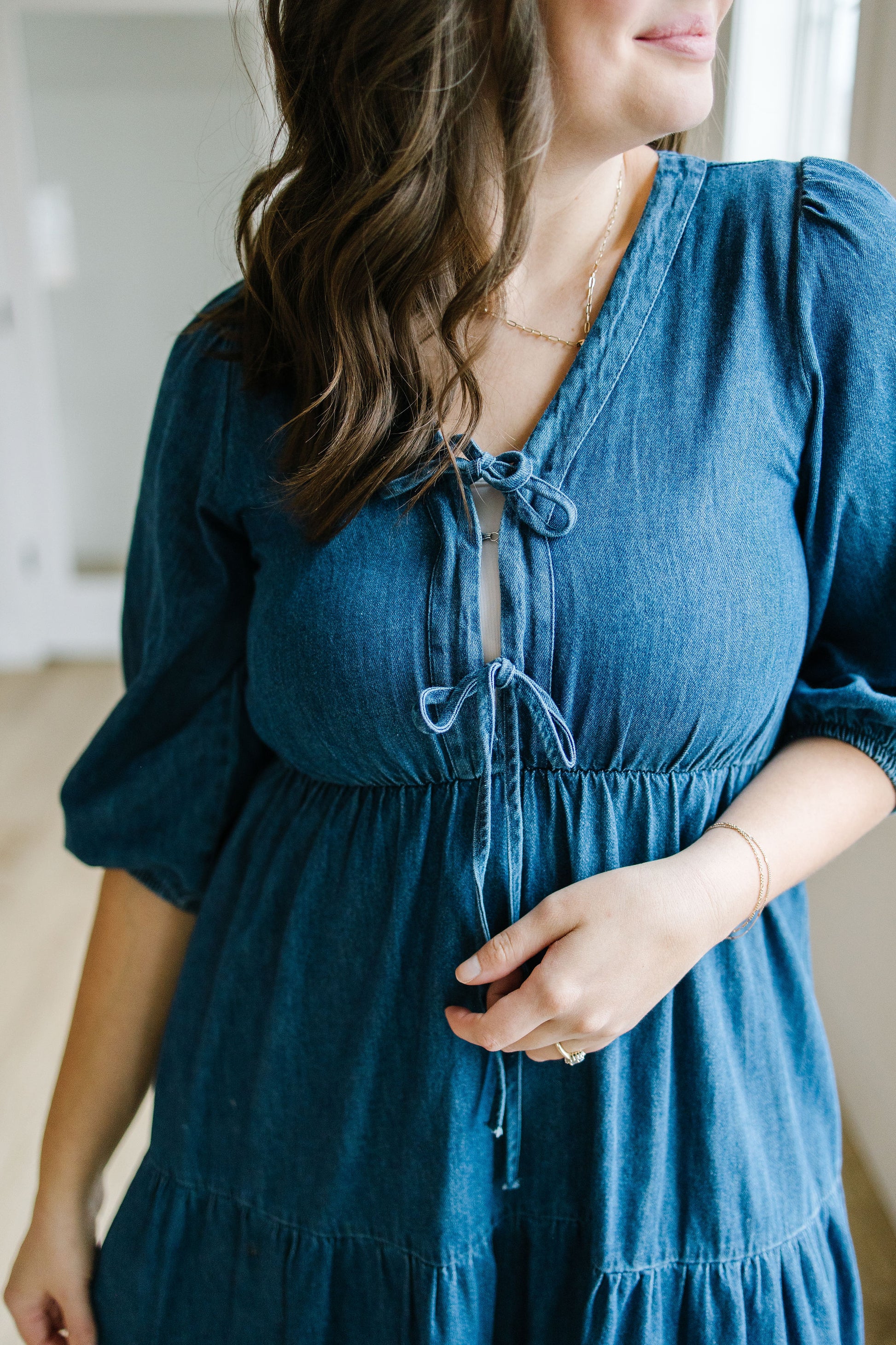 Woman wearing a blue dress with a blurred background