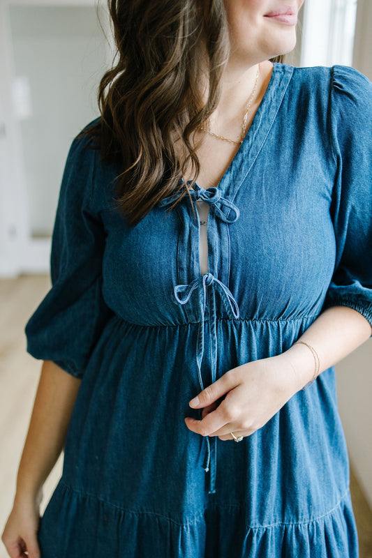 Woman wearing a blue dress with a blurred background