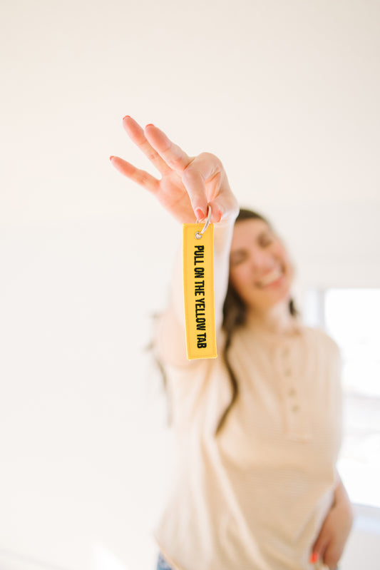 Pull on the Yellow Tab Keychain - Lettie Boutique